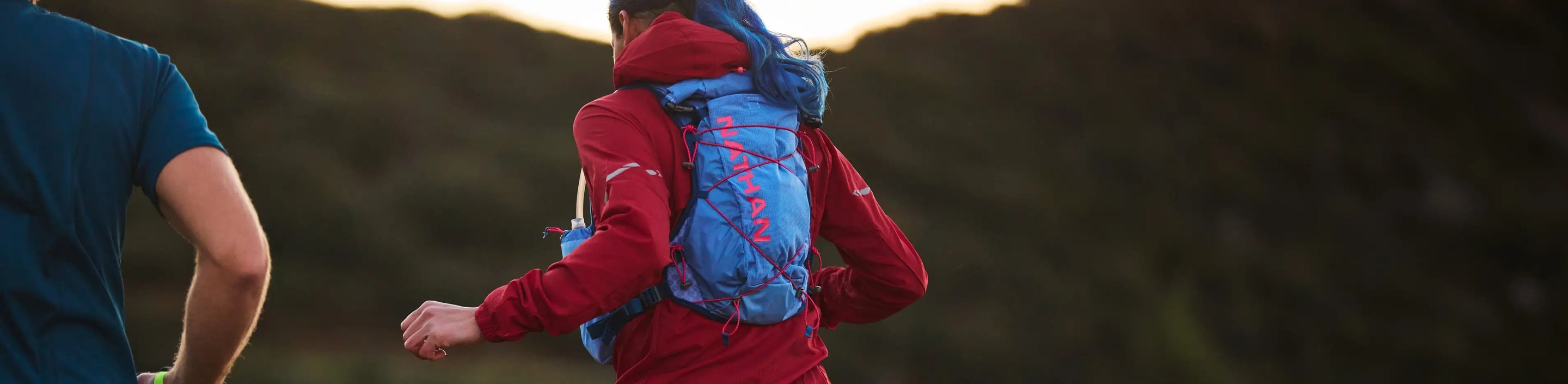 runner with new Nathan Sports TrailMix 2.0 12 Liter Hydration Pack